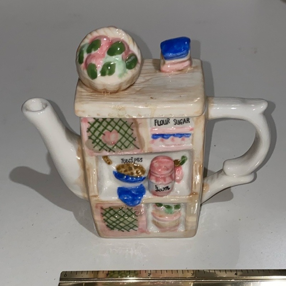 Charming Ceramic Teapot with Kitchen Shelf Design